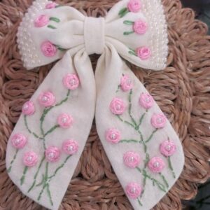 handcrafted off white long tail hair bow with floral embroidery and pearl details